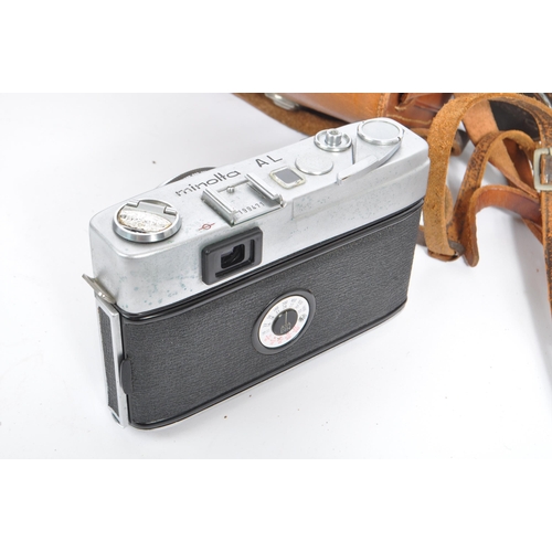 219 - A mid 20th century circa 1960s Minolta AF 35mm rangefinder camera alongside other 20th century camer... 