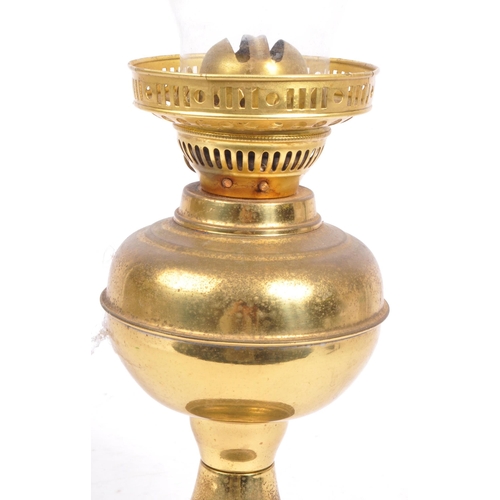 223 - A 19th century Victorian brass and glass oil lamp by Dilex, England. Having a clear glass flute with... 