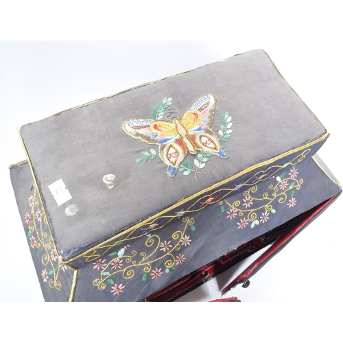 226 - A 1920s Chinese embroidered twin swing door sewing box. Having independant lidded box atop, embroide... 