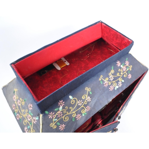 226 - A 1920s Chinese embroidered twin swing door sewing box. Having independant lidded box atop, embroide... 