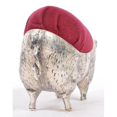 227 - A vintage 20th century large pin cushion on the form of an English pig / swine. With burgundy materi... 