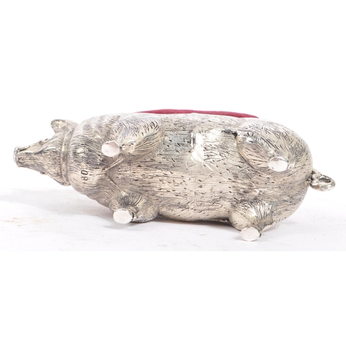 227 - A vintage 20th century large pin cushion on the form of an English pig / swine. With burgundy materi... 