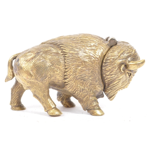 229 - A vintage 20th century brass vesta case in the form of Bison / Buffalo. In a standing position with ... 