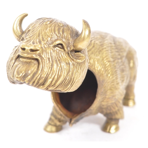 229 - A vintage 20th century brass vesta case in the form of Bison / Buffalo. In a standing position with ... 