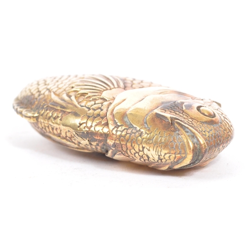 232 - A vintage 20th century brass metal vesta case in the form of an angel fish. With the head being the ... 