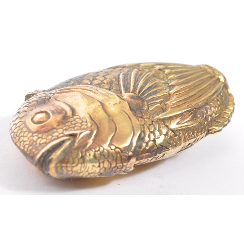 232 - A vintage 20th century brass metal vesta case in the form of an angel fish. With the head being the ... 