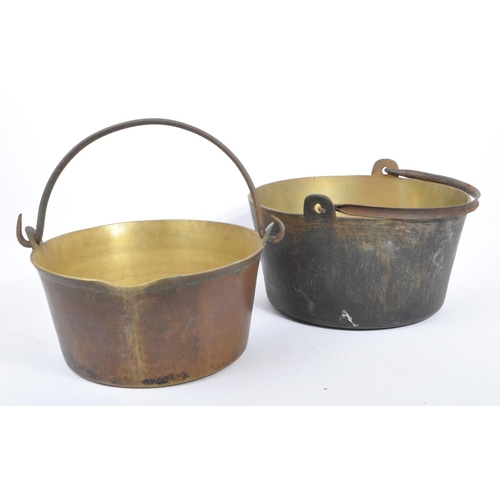 234 - An early 20th century circa 1920s copper tazza, alongside a collection of large brass pans / cooking... 