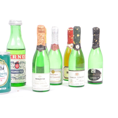 237 - A collection of thirteen vintage early 20th century miniature classic glass champagne bottles and al... 