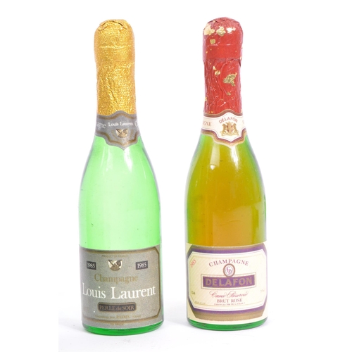 237 - A collection of thirteen vintage early 20th century miniature classic glass champagne bottles and al... 