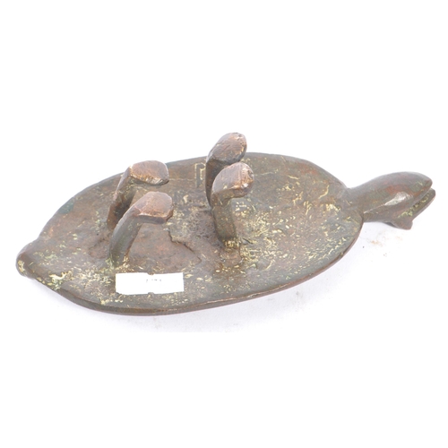 251 - A 20th century Asian bronze turtle figure. The figure raised on four legs, with engraved decoration ... 