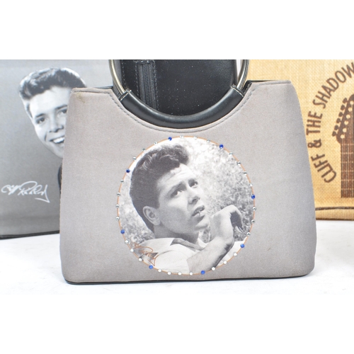 268 - Sir Cliff Richard - A collection of contemporary hand bags and purse / wallet. In the black and whit... 