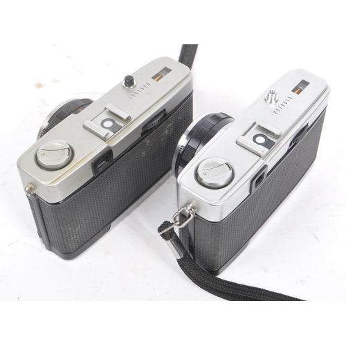 270 - Olympus Trip - Two mid 20th century Olympus Trip 35 35mm viewfinder cameras. One camera circa 1960s,... 