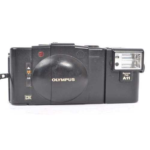 271 - Olympus XA - Two late 20th century Olympus XA range 35mm viewfinder scale focusing compact cameras. ... 