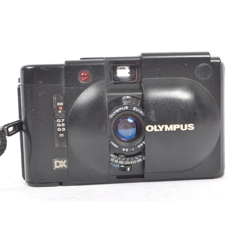 271 - Olympus XA - Two late 20th century Olympus XA range 35mm viewfinder scale focusing compact cameras. ... 