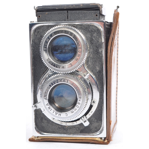 284 - Two mid 20th century TLR medium format film cameras. The collection to include a Halina Flex A1 came... 