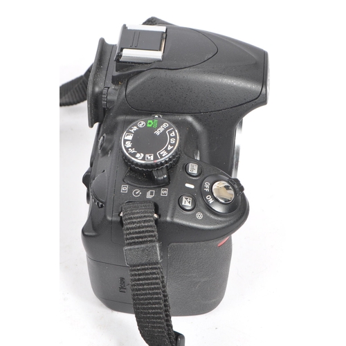 285 - Nikon - A contemporary circa 2010/11 Nikon D3100 digital SLR camera body. The camera in manufacturer... 