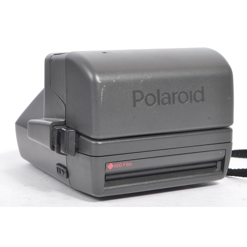 287 - Polaroid - A collection of late 20th century instant cameras and film. The lot to include a Polaroid... 