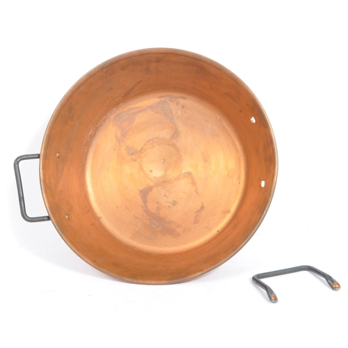 303 - A collection of 20th century copper zinc cookware, alongside a copper brass ewer. The collection to ... 