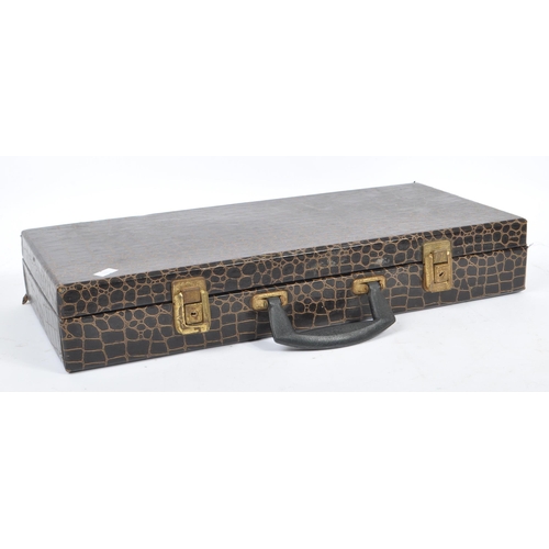 304 - A 20th century Chinese mahjong game set in a crocodile skin manner case. The set including two boxes... 