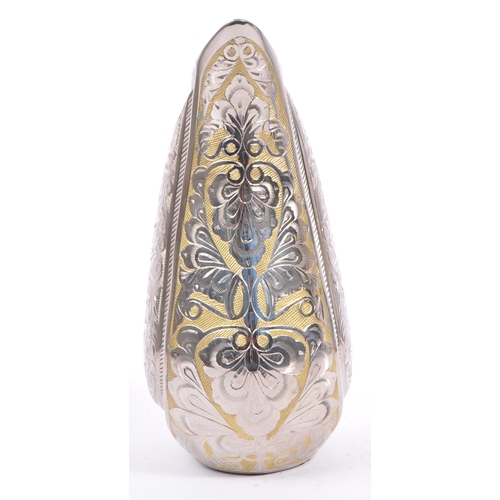 306 - A large contemporary aluminium teardrop shaped decoration / urn. The ornament in the shape of a tear... 