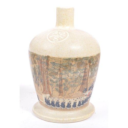 31 - A collection of vintage 20th century Japanese sake bottles and vases. Of circular form and ceramic p... 