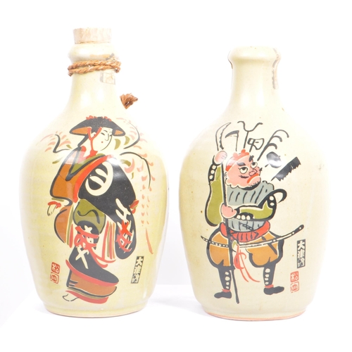 31 - A collection of vintage 20th century Japanese sake bottles and vases. Of circular form and ceramic p... 