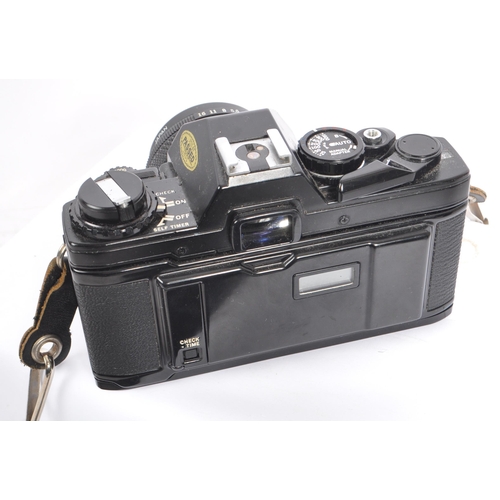 318 - Olympus - A late 20th century circa 1980s OM10 Quartz 35mm SLR camera with lenses and accessories. T... 