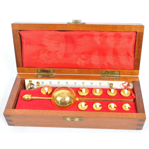 319 - A set of early 20th century Stanton Instruments Ltd - Morden, Surrey. Open cased brass balance scien... 