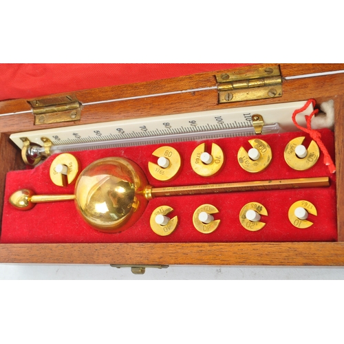 319 - A set of early 20th century Stanton Instruments Ltd - Morden, Surrey. Open cased brass balance scien... 