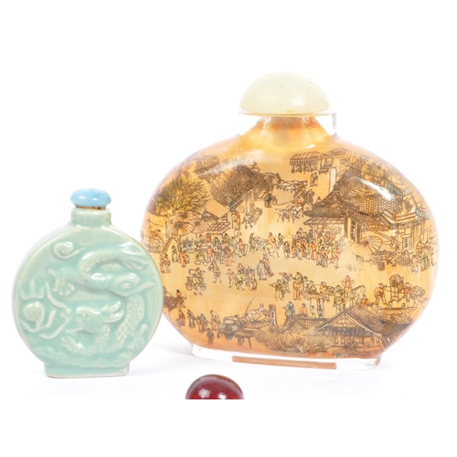 320 - A collection of Chinese curios to include an enamelled cloisonné frog pendant, a Chinese carved boxw... 