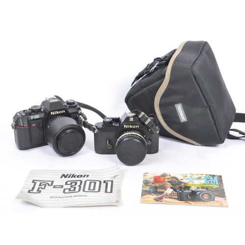 322 - Nikon - Two 20th century 35mm SLR film cameras. The lot consisting of a Nikon EM 35mm SLR camera wit... 