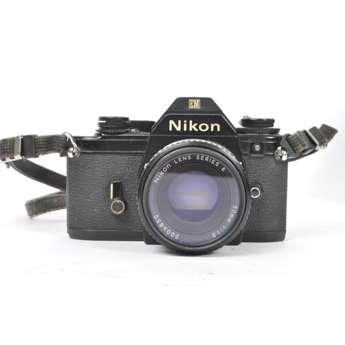 322 - Nikon - Two 20th century 35mm SLR film cameras. The lot consisting of a Nikon EM 35mm SLR camera wit... 