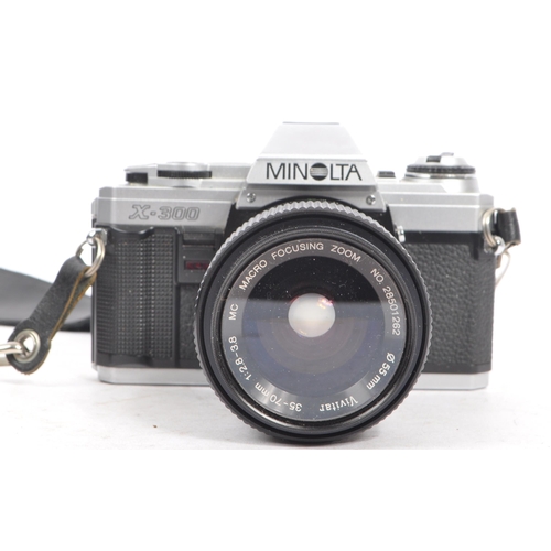 325 - Minolta / Vivitar - A 20th century Minolta 35mm SLR film camera and lenses. The lot to include a Min... 