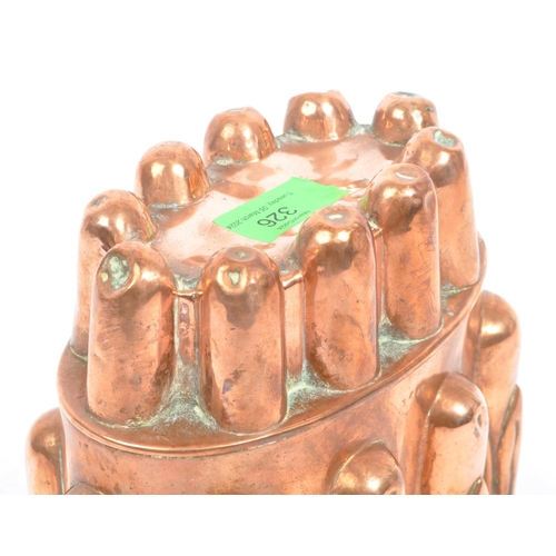 326 - A 19th century Victorian copper jelly mould stamped 361C. The jelly mould having scrolled design aro... 