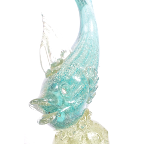 33 - A mid 20th century Murano studio art glass fish. The fish resting atop a glass form in the manner of... 