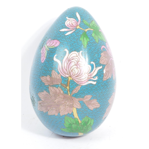 336 - A large early-mid 20th century gilt metal and enamel cloisonne egg. Featuring lily design and decora... 