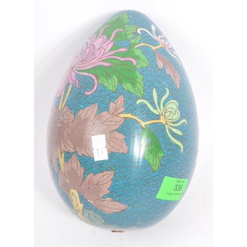 336 - A large early-mid 20th century gilt metal and enamel cloisonne egg. Featuring lily design and decora... 