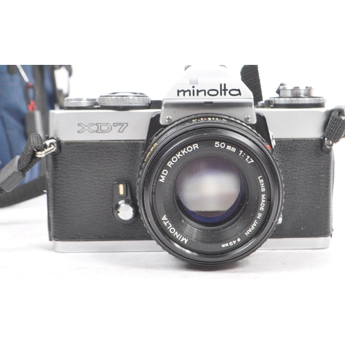 339 - Minolta - Two 20th century Minolta XD7 35mm SLR film cameras with lenses. The collection to include ... 