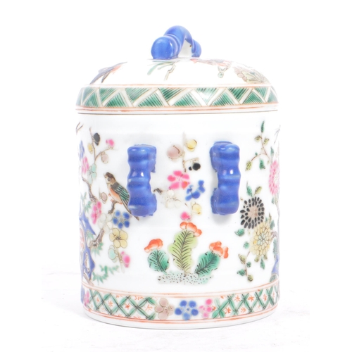 34 - An early 20th century circa 1920s Chinese porcelain tea caddy. The caddy having a white ground, with... 