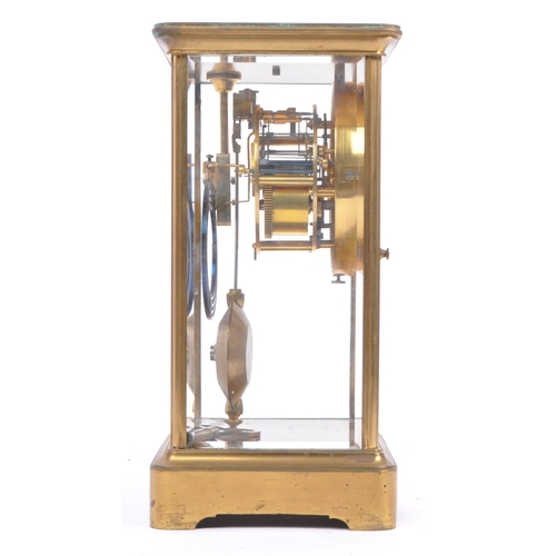 340 - A French eight day movement brass four glass mantel clock. Rectangular form with enamelled face with... 