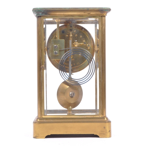 340 - A French eight day movement brass four glass mantel clock. Rectangular form with enamelled face with... 