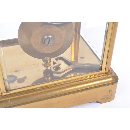 340 - A French eight day movement brass four glass mantel clock. Rectangular form with enamelled face with... 