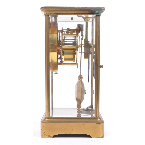 340 - A French eight day movement brass four glass mantel clock. Rectangular form with enamelled face with... 