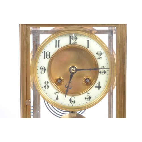 340 - A French eight day movement brass four glass mantel clock. Rectangular form with enamelled face with... 