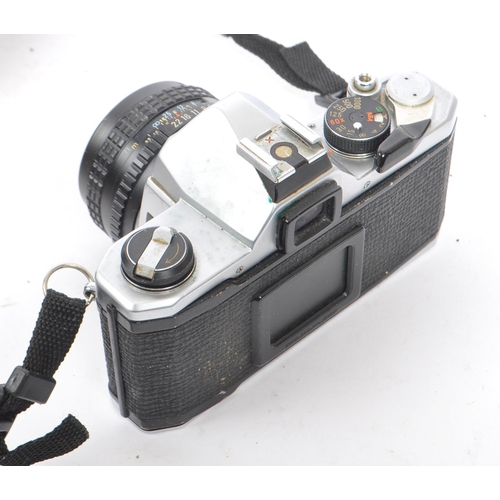 341 - Pentax - Two 20th century Pentax 35mm SLR film cameras, with lenses. The collection to include a Pen... 