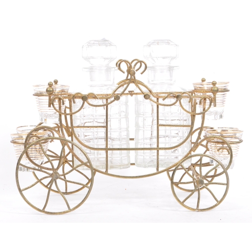 349 - A vintage four wheel wire liqueur decanter carriage cart. Frame to house two decanter bottles with o... 