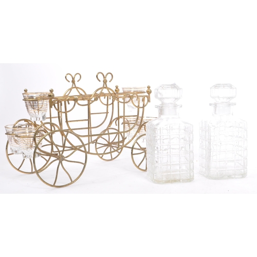 349 - A vintage four wheel wire liqueur decanter carriage cart. Frame to house two decanter bottles with o... 