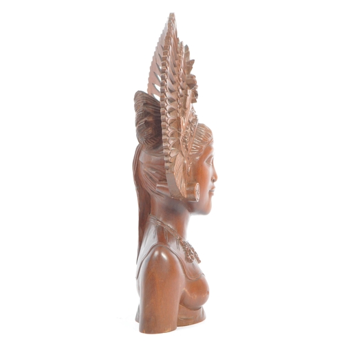 350 - A 20th century Balinese teak wood bust carving sculpture of a lady with ceremonial headdress. With i... 