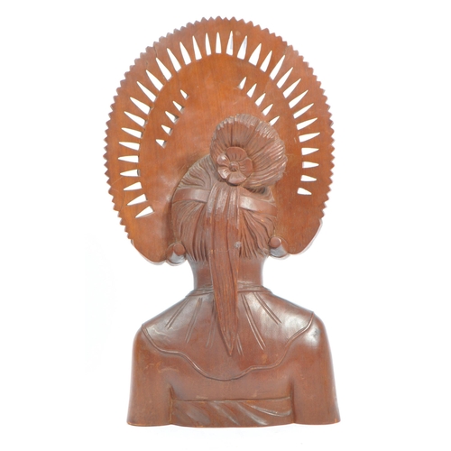 350 - A 20th century Balinese teak wood bust carving sculpture of a lady with ceremonial headdress. With i... 