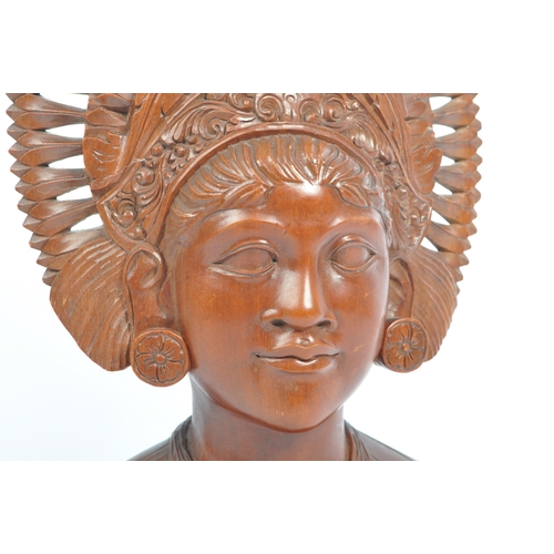 350 - A 20th century Balinese teak wood bust carving sculpture of a lady with ceremonial headdress. With i... 